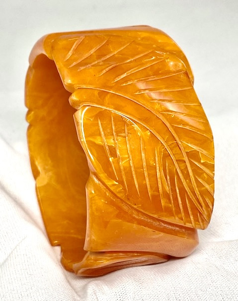 BB419 wide leaf carved apricot bakelite bangle